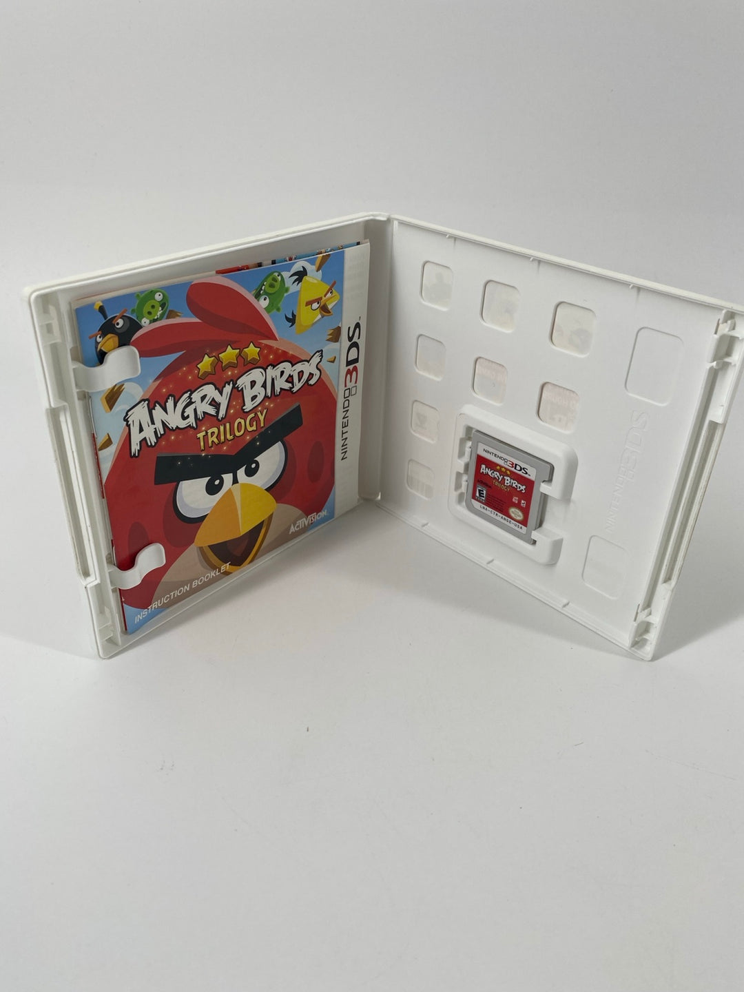 Nintendo 3DS Angry Birds Trilogy open case with manual and cartridge