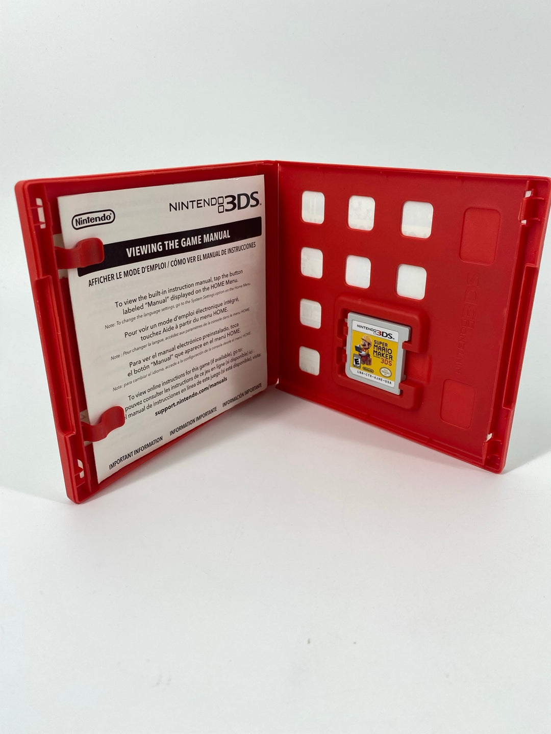 Nintendo 3DS Super Mario Maker open red case with cartridge and insert - actual item photo